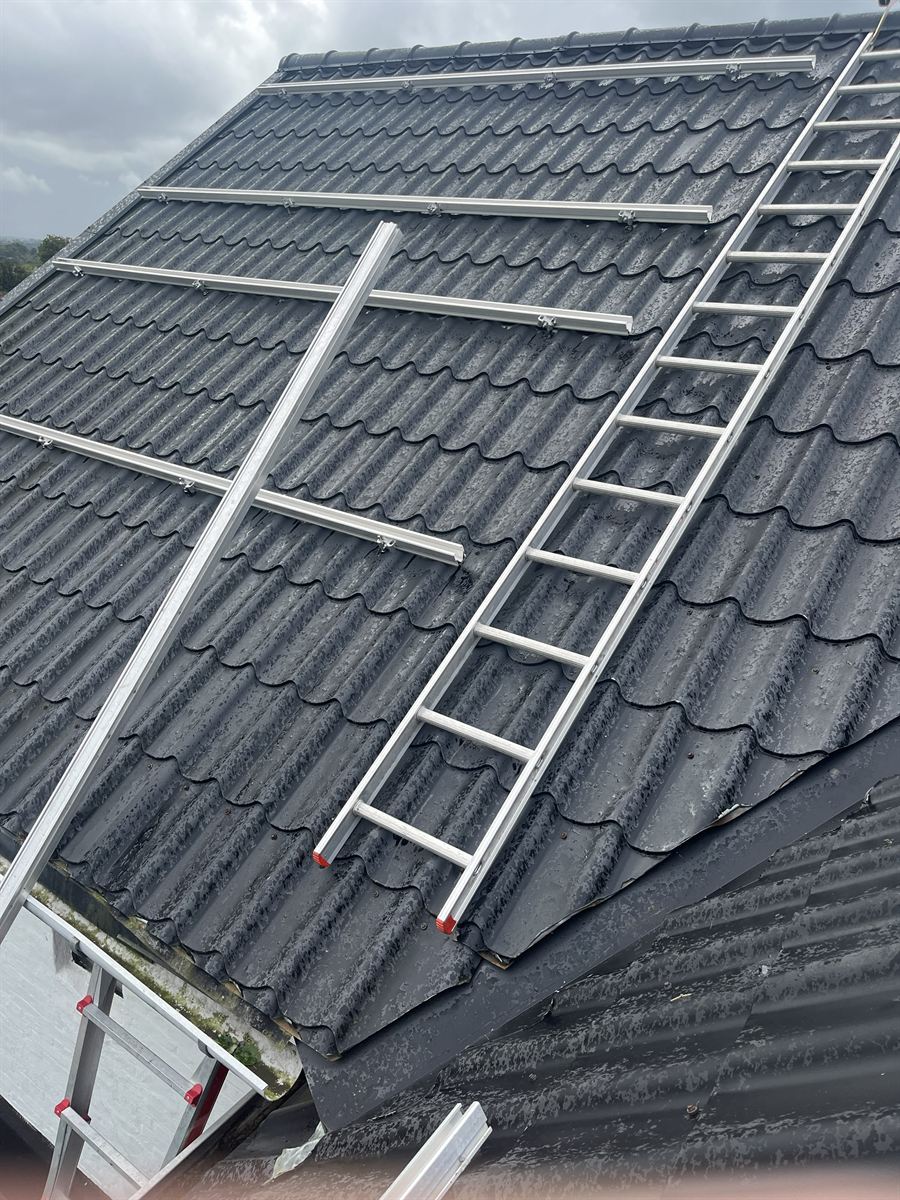 Solar panel mounting rails on a tiled roof